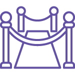 Icon of a red carpet event: a pathway flanked by two stanchions on either side, connected by ropes, leading up to a highlighted spot. The illustration is in purple and appears to depict an entrance or VIP area, like the exclusive benefits of Medterra Subscribe & Save with free shipping.